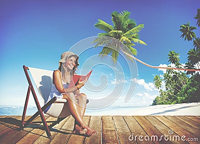 Woman Reading on Beach Relaxation Resting Concept Stock Photo