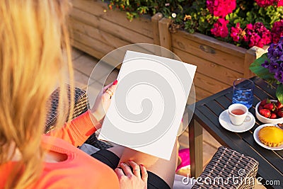 Woman reading blank sample page, empty template for your own design. Stock Photo