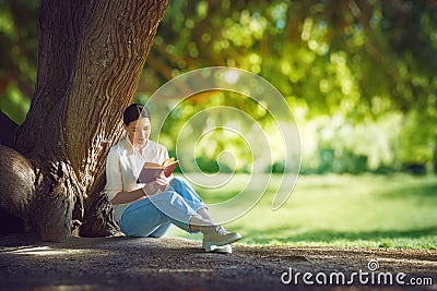 Woman reading a book Stock Photo