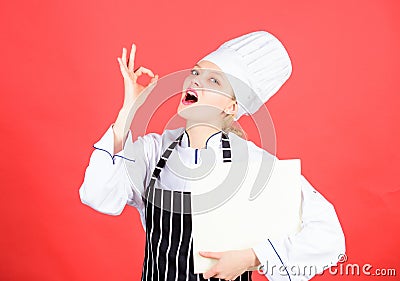 Woman reading cook book in kitchen. Tips and advice. Cooking food. Delicious and gourmet. Chef author culinary book Stock Photo