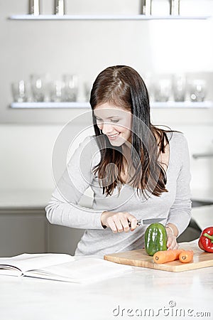 Woman reading cookery book Stock Photo