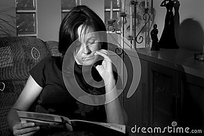 Woman reading at home Stock Photo