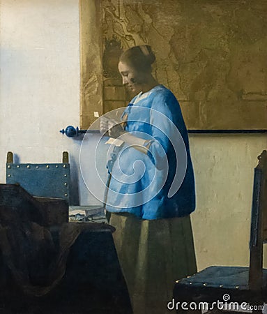 Woman reading a letter, painting by Johannes Vermeer Editorial Stock Photo