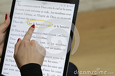 Woman reading and studying the gospels of the bible Stock Photo