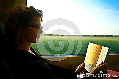 Woman reading in the train Stock Photo