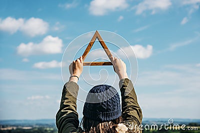 Woman Rear View Holding Triangle Mountain Carefree Cloudscape C Stock Photo