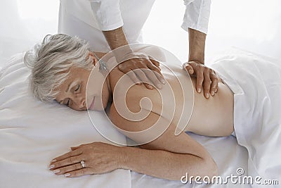 Woman Receiving Back Massage Stock Photo