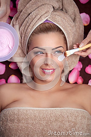 Woman receiving hydration facial mask Stock Photo