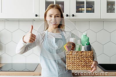 Woman recommend cleaning products, showing thumbs up Stock Photo