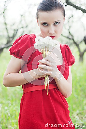 Woman in red dress with posy Stock Photo