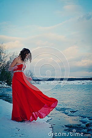 Woman in red dress. Siberia, ice water, winter, very cold Stock Photo