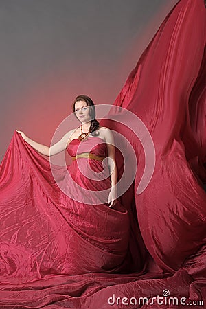 Woman in red flying dress Stock Photo