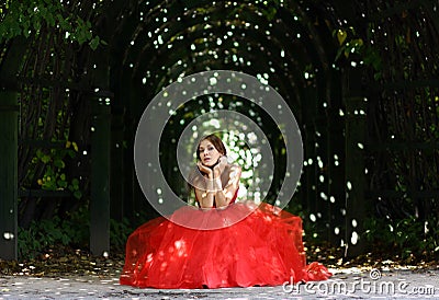 Woman in a red gothic dress Stock Photo