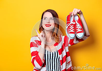 Woman with red gumshoes Stock Photo