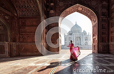 Woman in red saree/sari in the Taj Mahal, Agra, Uttar Pradesh, India Stock Photo