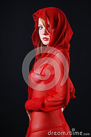 Woman in red transparent with hood Stock Photo