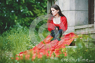 Woman in red Victorian dress Stock Photo