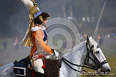 Woman reenactor rides a horse at Borodino battle historical reenactment in Russia Editorial Stock Photo