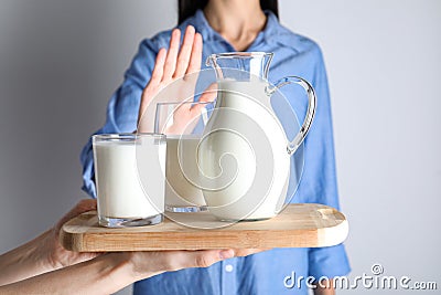 Woman refusing to drink milk. Food allergy concept Stock Photo