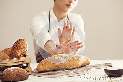 Woman refusing to eat white bread Stock Photo