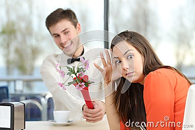 Woman rejecting a geek boy in a blind date Stock Photo