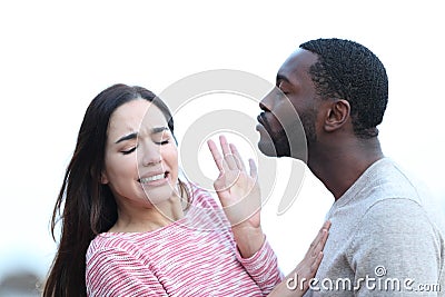 Woman rejecting a man who is trying to kiss her Stock Photo