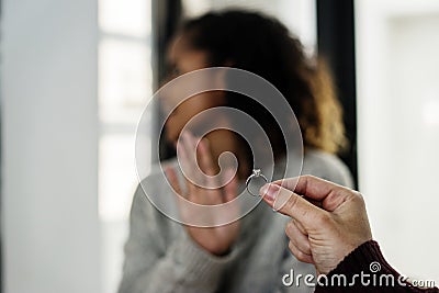 Woman rejecting a marriage proposal Stock Photo