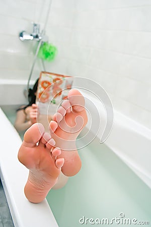 Woman relaxing in bath Stock Photo