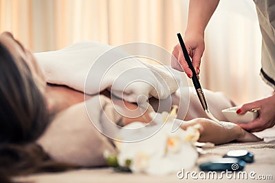 Woman relaxing at beauty center during treatment for skin rejuvenation Stock Photo