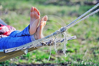 Woman relaxing in hammock Stock Photo