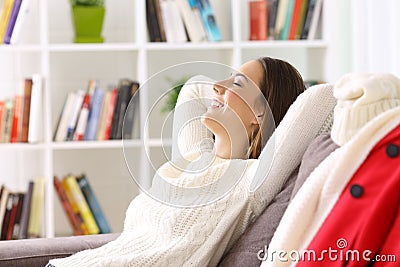 Woman relaxing at home in winter Stock Photo