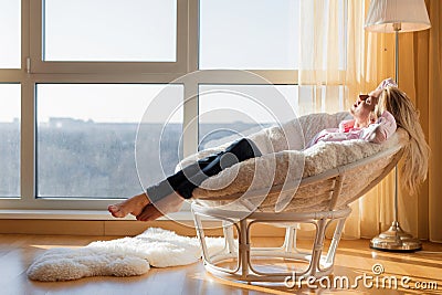 Woman relaxing at home Stock Photo