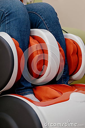 Woman relaxing in massage armchair Stock Photo