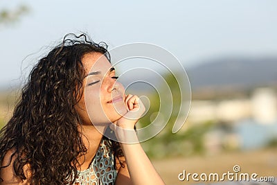 Woman relaxing in a warmth park Stock Photo