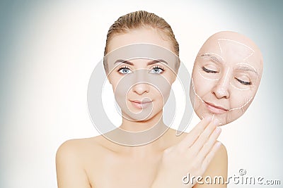 woman releases her face from wrinkles Stock Photo