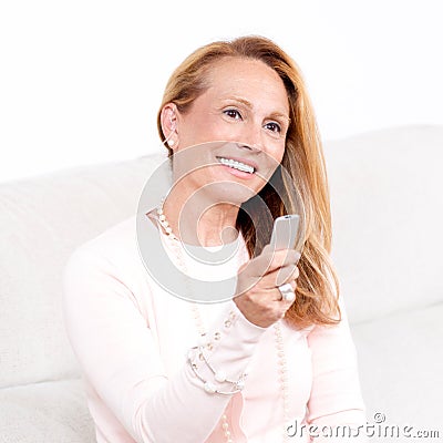 Woman with a remote controle Stock Photo