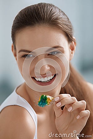 Woman with removable teeth braces for dental correction Stock Photo