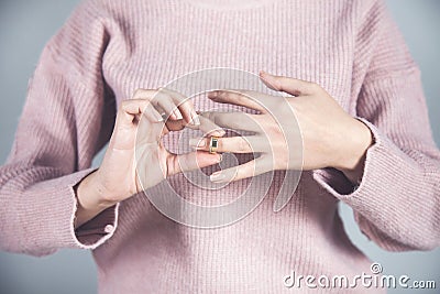 Woman remove ring Stock Photo