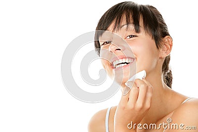 Woman removing makeup Stock Photo