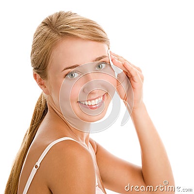 Woman removing makeup Stock Photo