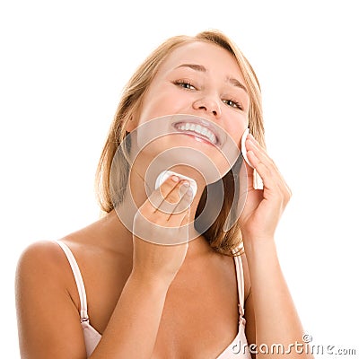 Woman removing makeup Stock Photo