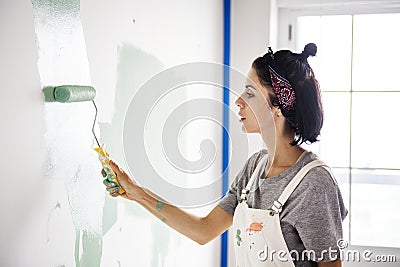 Woman renovating the house alone Stock Photo