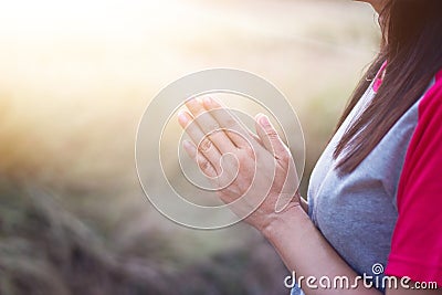 Woman respect and pray on nature background Stock Photo