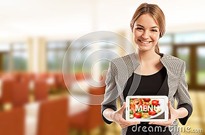 Woman restaurant manager holding tablet with menu Stock Photo