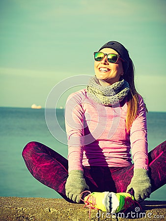 Woman resting after doing sports outdoors on cold day Stock Photo