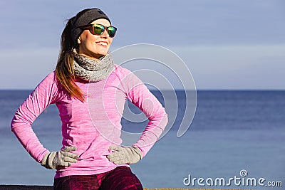 Woman resting after doing sports outdoors on cold day Stock Photo