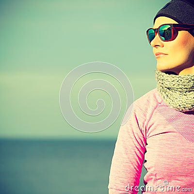 Woman resting after doing sports outdoors on cold day Stock Photo