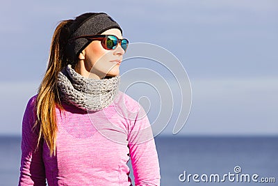 Woman resting after doing sports outdoors on cold day Stock Photo