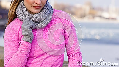 Woman resting after doing sports outdoors on cold day Stock Photo