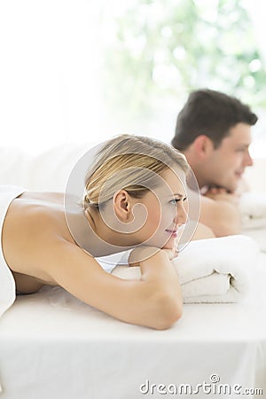 https://thumbs.dreamstime.com/x/woman-resting-massage-table-spa-side-view-beautiful-young-man-background-health-32429860.jpg